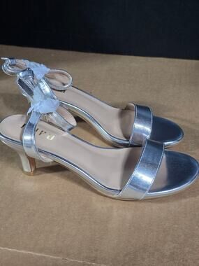 IDIFU mirror-finish metallic silver kitten heel sandals.